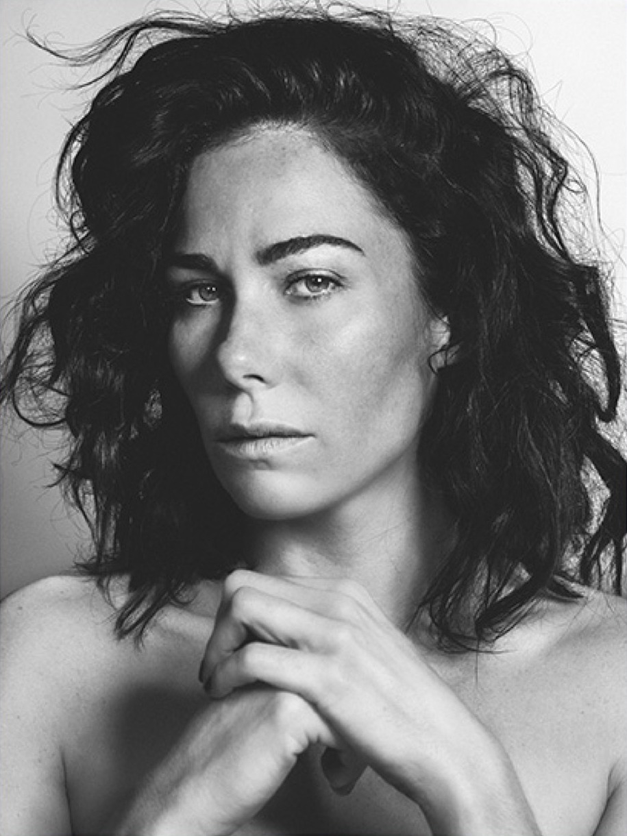 Beauty portrait in black-and-white, natural make-up, hands at the chin