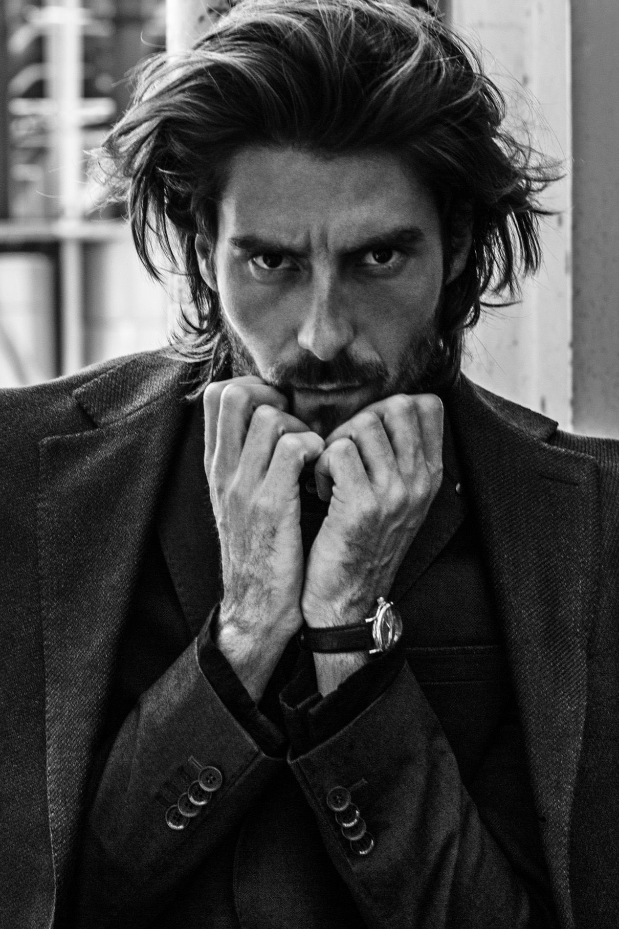 Editorial hair and make-up in black and white, male portrait with long hair and tweed blazer